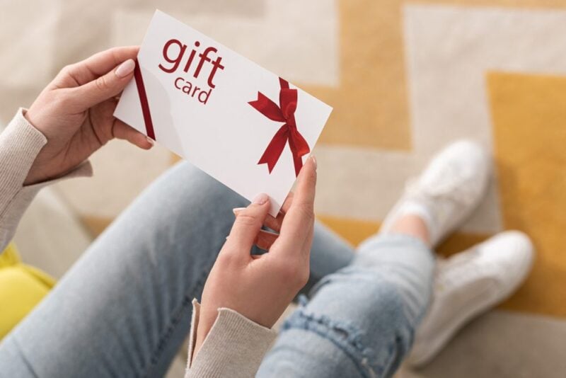 Woman holding a Gift card